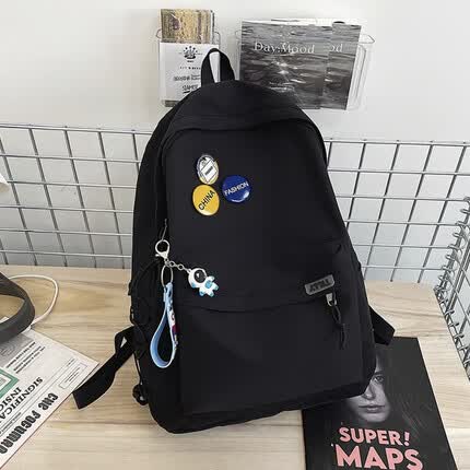 游乐者双肩包男士大容量简约旅行电脑背包女休闲高中大学生初中生书包男 黑色+徽章+蓝色太空人