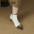 TATA  GLARE猫跟短靴女细跟尖头裸靴秋冬新款法式气质时尚拼色显瘦高跟马丁靴 白色 34