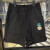 耐克（Nike）女子短裤2024夏季新款小雏菊刺绣梭织透气宽松休闲工装运动五分裤 HJ9424-010黑色 M