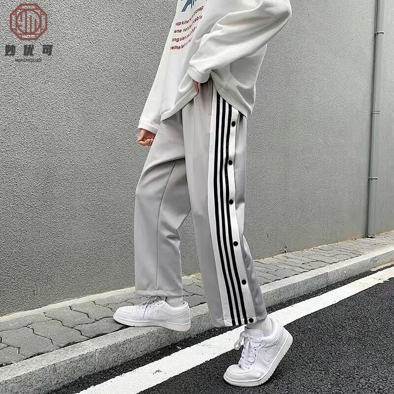妙優(yōu)可 大學(xué)生男女情侶款運(yùn)動側(cè)開紐扣雙排扣褲子休閑褲闊腿褲2025 灰色【男女同款】 S