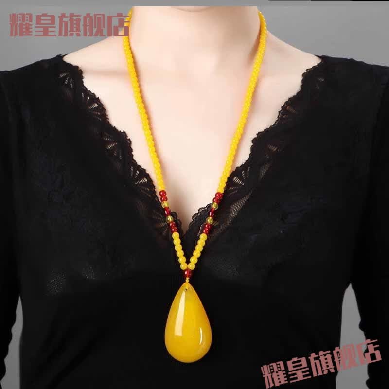 莲雨恋星老蜜蜡琥珀吊坠血珀男女款长款项链鸡油黄毛衣链蜜蜡吊坠 年年有余怎么看?