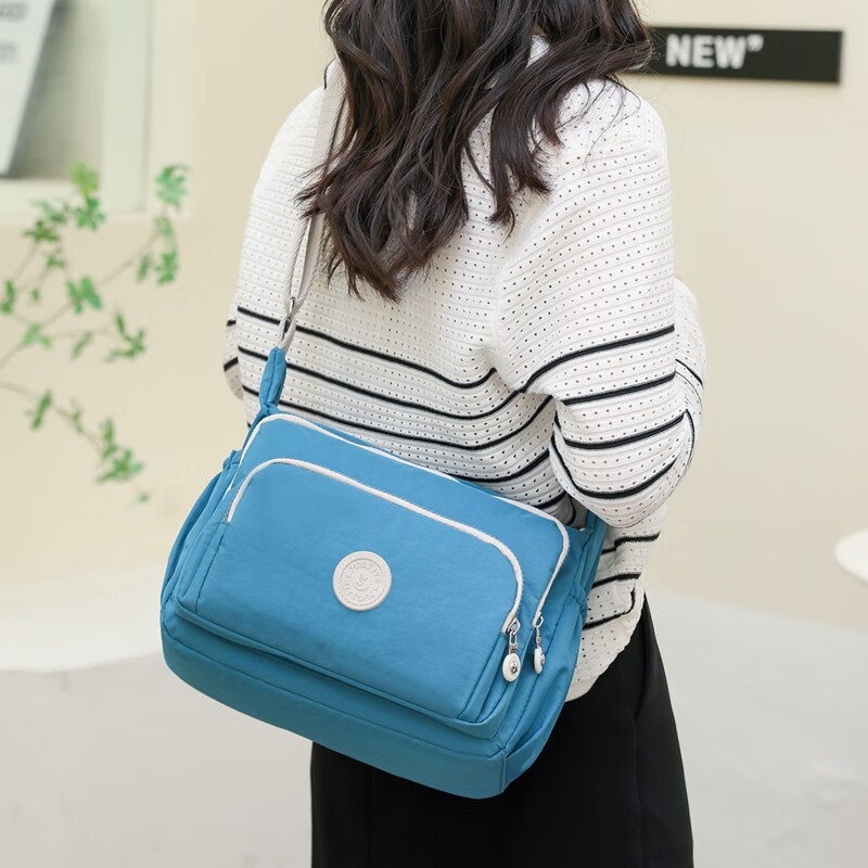 包女包休闲简约妈妈包尼龙布斜挎包轻便手机包新款帆布小背包 秋波蓝