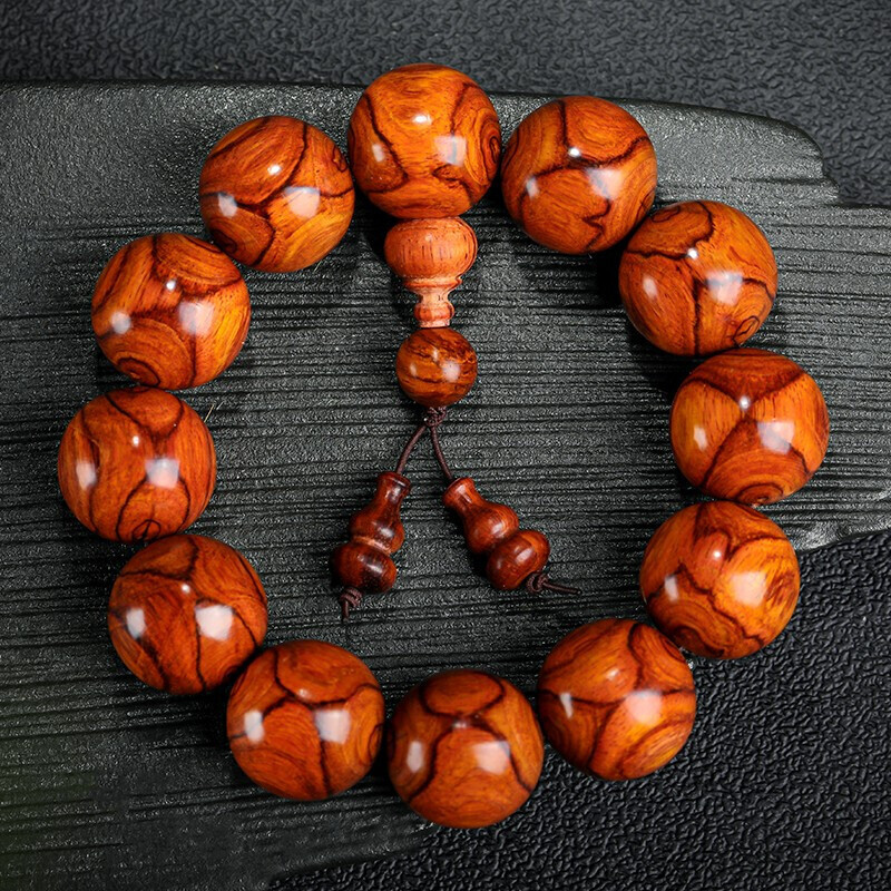 月印百川海南黄花梨手串对眼鬼脸纹文玩佛珠男女款手链送礼收藏属于什么档次？