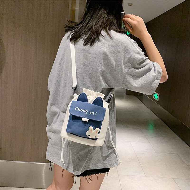 四万公里帆布包女包带挂件学生包日系手机包文艺休闲单肩背包斜挎包怎么看?