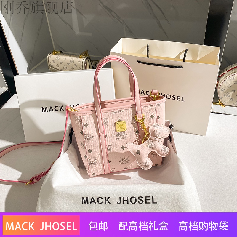 舒凝雪香港mackjhosel真皮粉色水桶包菜篮子手提包包女2021新款潮斜