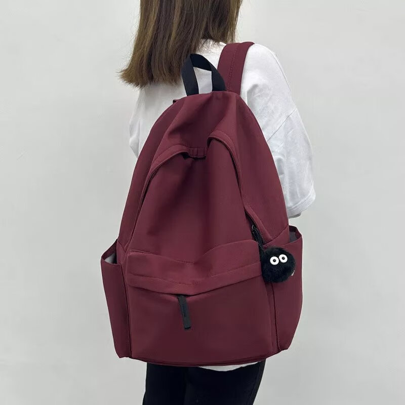 韩版ins书包女中学生大容量简约纯色背包初中高中大学生双肩包男 酒红色【带隔层 带大后兜 版】 【加煤球挂件】