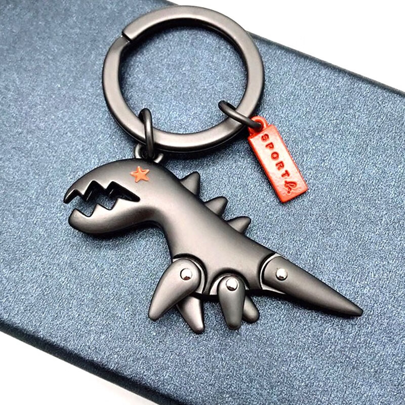 漫画の小さな恐竜キーホルダー女性男性車の金属キーリングカップルペンダントキーチェーンガールフレンド ガールフレンド クラスメート 誕生日プレゼント 子供の日のギフト パールブラック恐竜