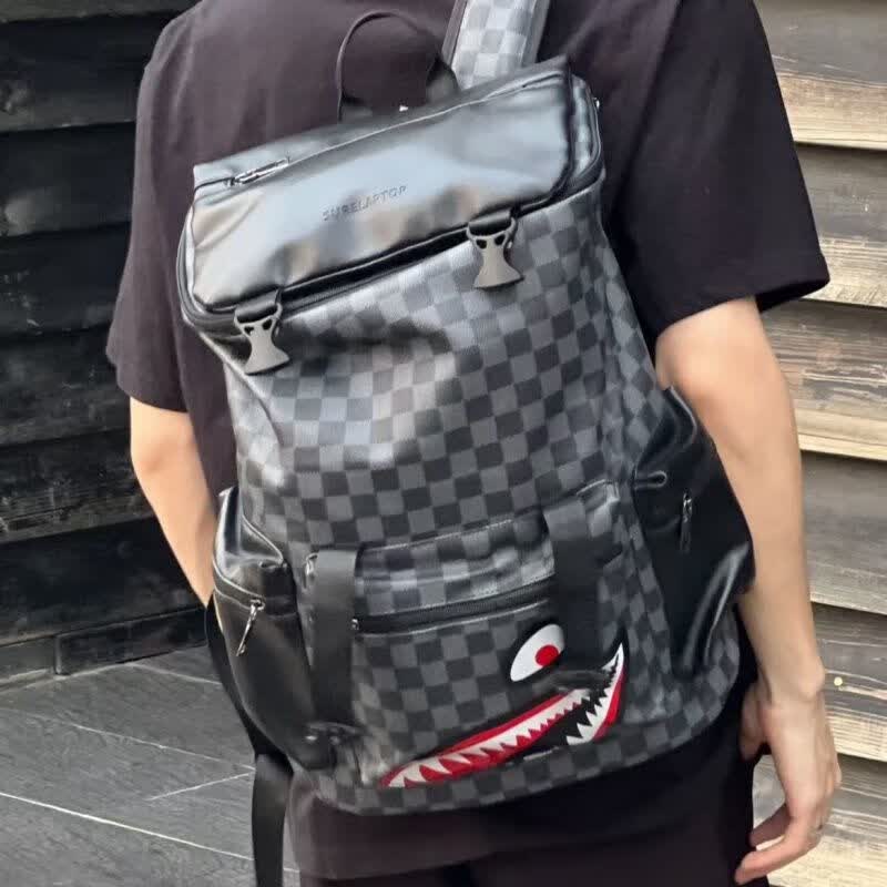 DRYWORLD潮牌双肩包商务新年格子旅行包旅游学生书包潮电脑包 黑色红眼睛