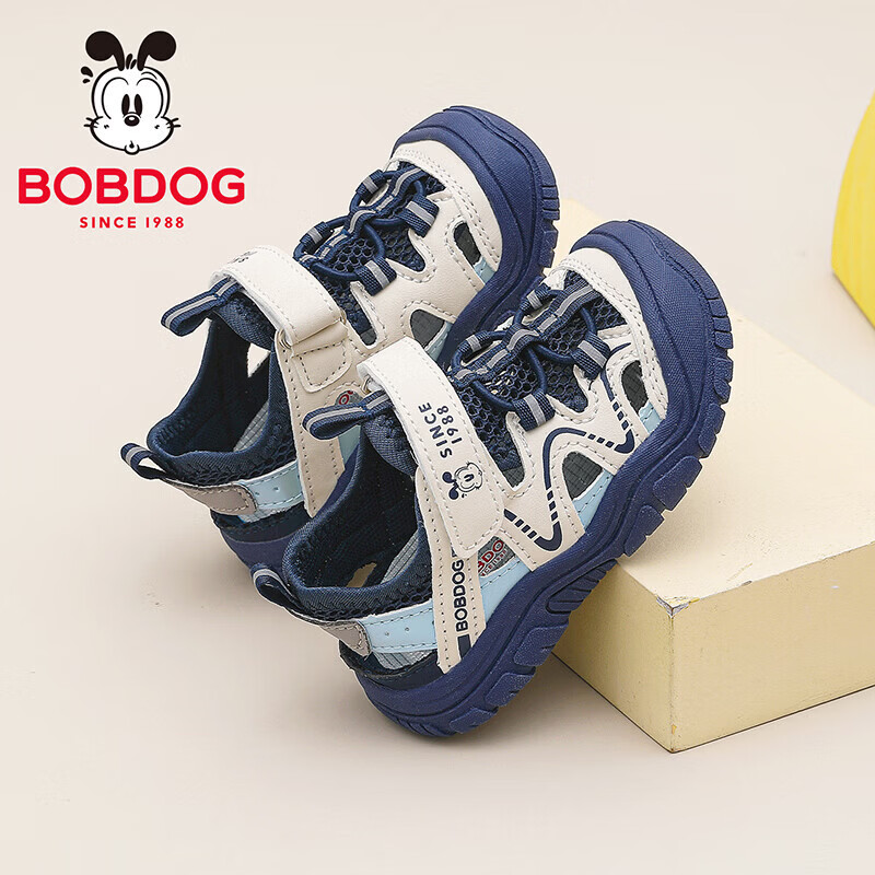 巴布豆(BOBDOG)童鞋男童夏季透气框子鞋2026女宝小童春秋学步鞋低帮儿童运动凉鞋 藏青蓝/米 22 适合脚长13.5CM