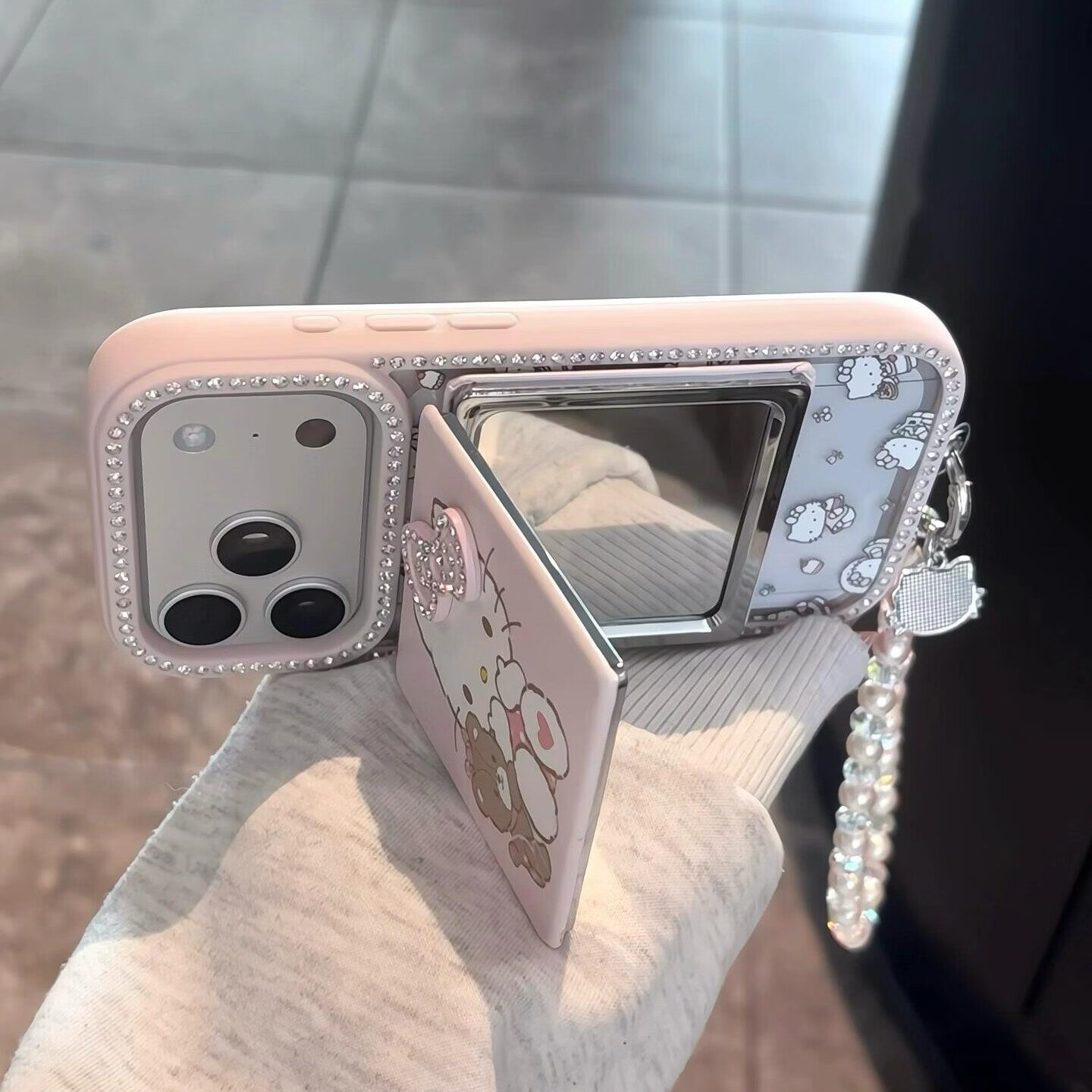 适用苹果17promax手机壳iphone15pro立体水钻蝴蝶结kitty镜子16pro可爱卡通16网红女款超好看外壳 透粉单壳+镜子+手链 iphone 17 Pro Max