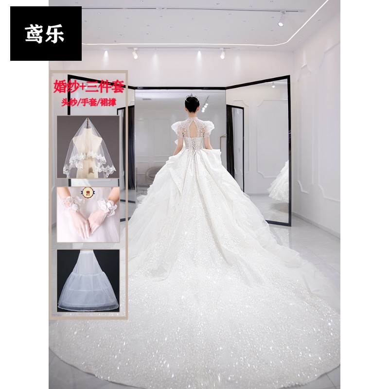 高档轻奢鸢乐轻奢品牌婚纱礼服2022新款新娘主纱大拖尾感夏季法式在逃公主白色 白色拖尾婚纱配三件套 S属于什么档次？