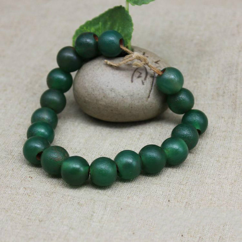 古玩老珠子老西周绿玛瑙圆珠串老绿玛瑙佛珠手串喇叭孔包浆风化纹 1.